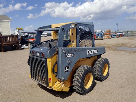 how much does a john deere skid steer weigh|john deere 320d skid steer.